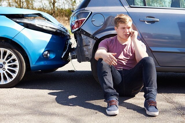 man sitting on the floor after an accident