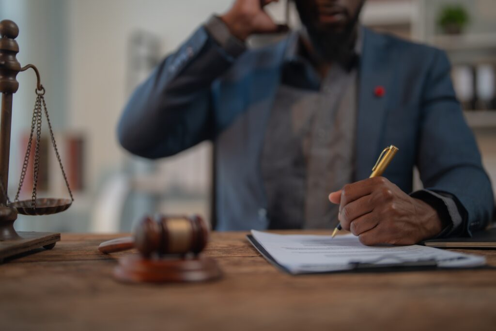 personal injury lawyer signing a contract