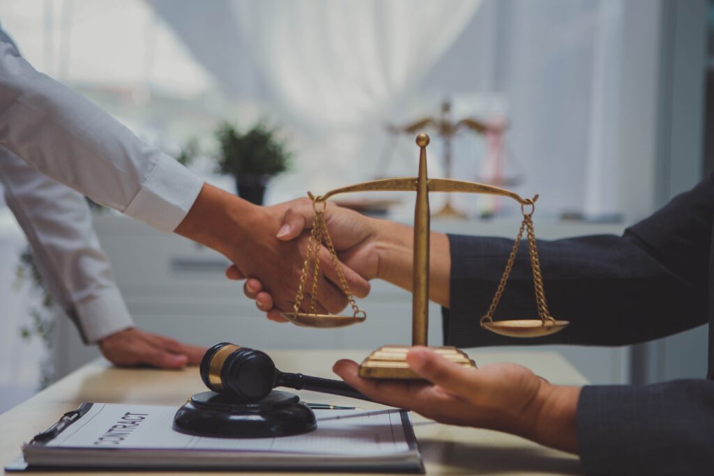 handshake between lawyer and client